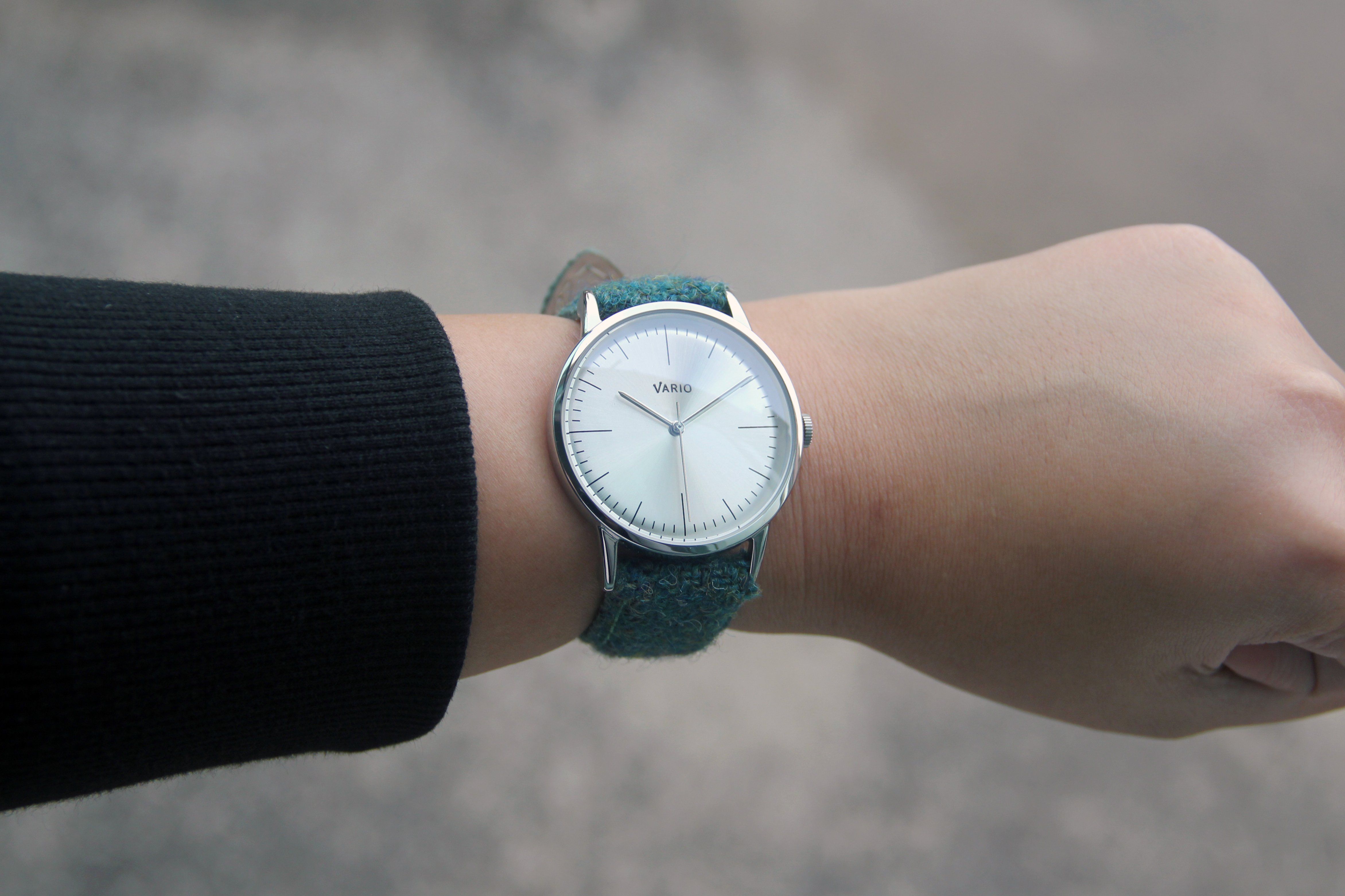 eclipse 38mm silver dress watch with harris tweed strap on wrist