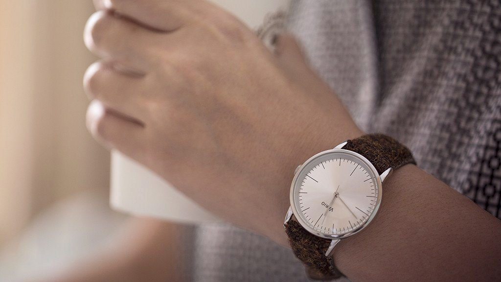 eclipse 38mm silver dress watch with harris tweed strap on wrist