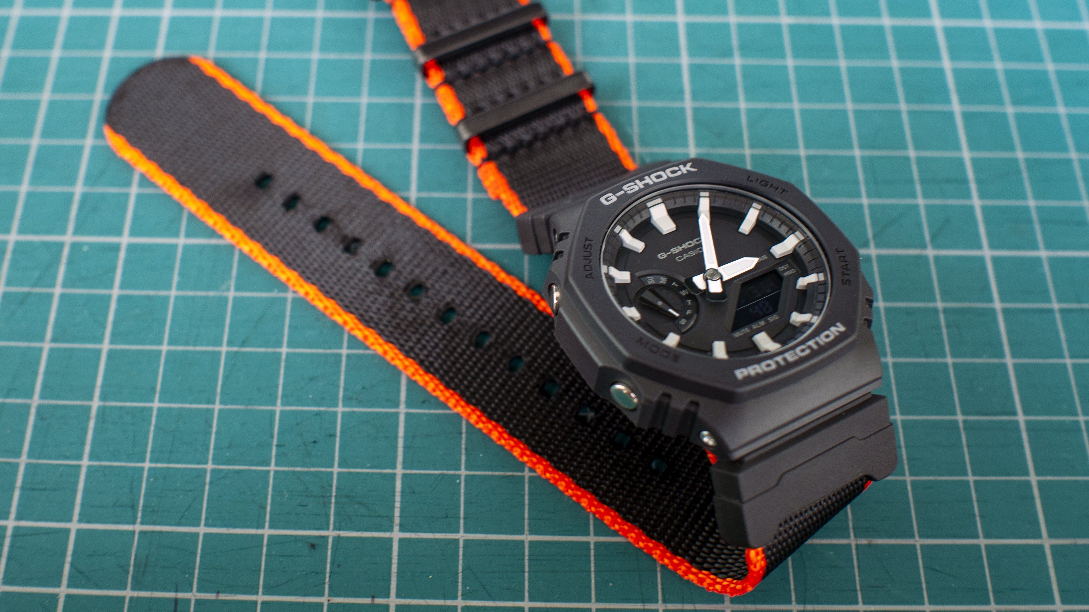 Casio GShock GA2100 black orange seat belt